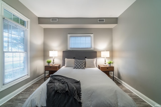 807 W Washington Blvd, Fort Wayne, IN 46802 - bedroom featuring dark wood-style floors and baseboards
