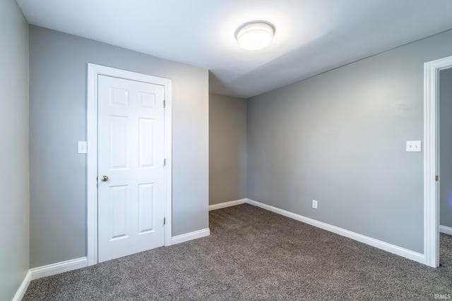 807 W Washington Blvd, Fort Wayne, IN 46802 - empty room with dark carpet and baseboards