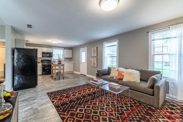 807 W Washington Blvd, Fort Wayne, IN 46802 - living area with wood finished floors and baseboards