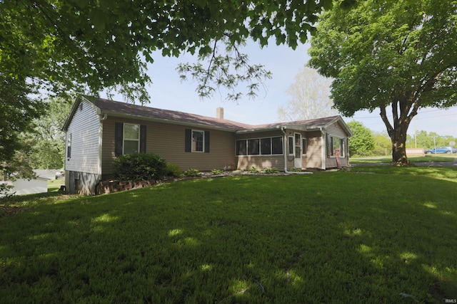 482 E Jefferson St, Andrews, IN 46702 - back of house featuring a chimney and a yard