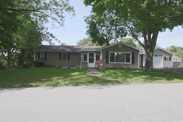 482 E Jefferson St, Andrews, IN 46702 - ranch-style house with a garage, a front yard, and driveway
