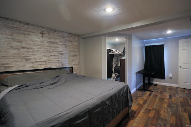 482 E Jefferson St, Andrews, IN 46702 - bedroom featuring wood finished floors, baseboards, a spacious closet, wooden walls, and recessed lighting