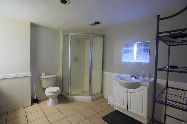 482 E Jefferson St, Andrews, IN 46702 - full bath with vanity, a stall shower, toilet, and tile patterned floors