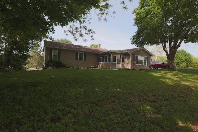482 E Jefferson St, Andrews, IN 46702 - ranch-style house with a front lawn and a chimney