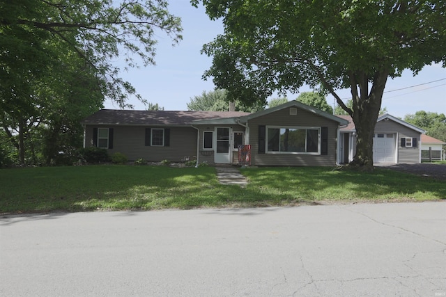 482 E Jefferson St, Andrews, IN 46702 - ranch-style home featuring a front lawn, an attached garage, and driveway