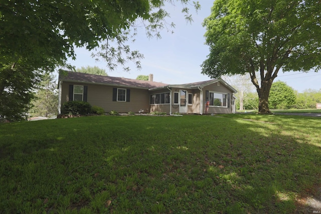 482 E Jefferson St, Andrews, IN 46702 - view of front of property featuring a front lawn and a chimney