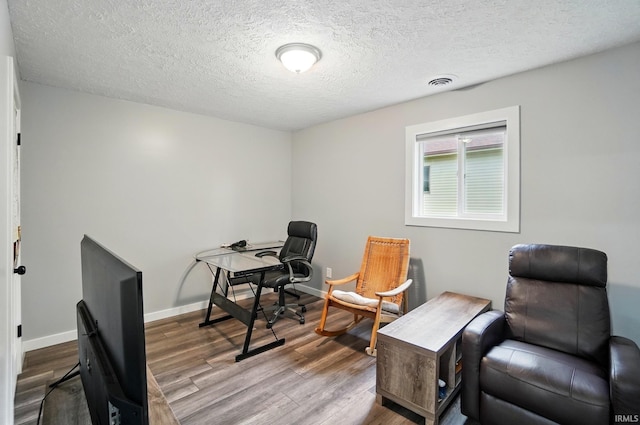 202 E Pickwick Dr, Syracuse, IN 46567 - office area with wood finished floors, a textured ceiling, and baseboards