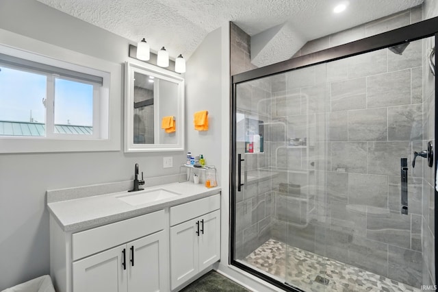 202 E Pickwick Dr, Syracuse, IN 46567 - bathroom with vanity, a shower stall, a textured ceiling, and recessed lighting