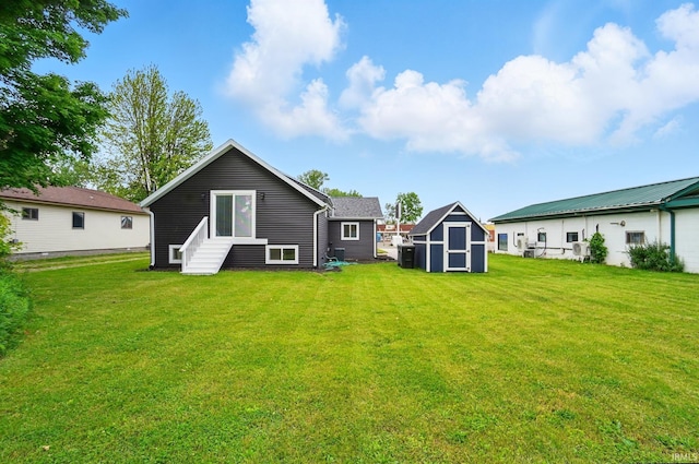 202 E Pickwick Dr, Syracuse, IN 46567 - rear view of house with a lawn and entry steps