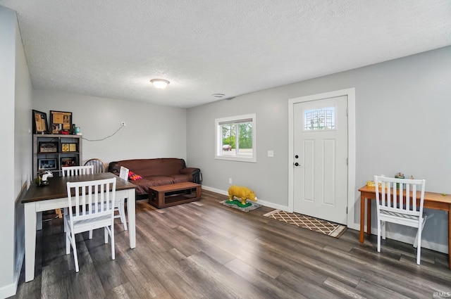 202 E Pickwick Dr, Syracuse, IN 46567 - office area featuring wood finished floors, baseboards, and a textured ceiling