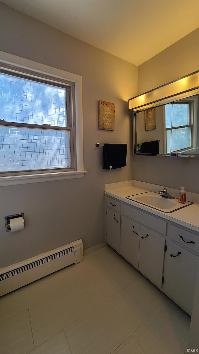 6403 Old Trail Rd, Fort Wayne, IN 46809 - bathroom featuring vanity, a baseboard heating unit, and tile patterned floors