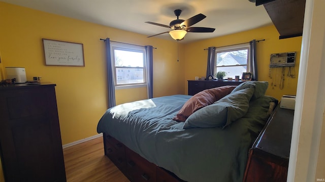 6403 Old Trail Rd, Fort Wayne, IN 46809 - bedroom featuring wood finished floors, baseboards, and a ceiling fan
