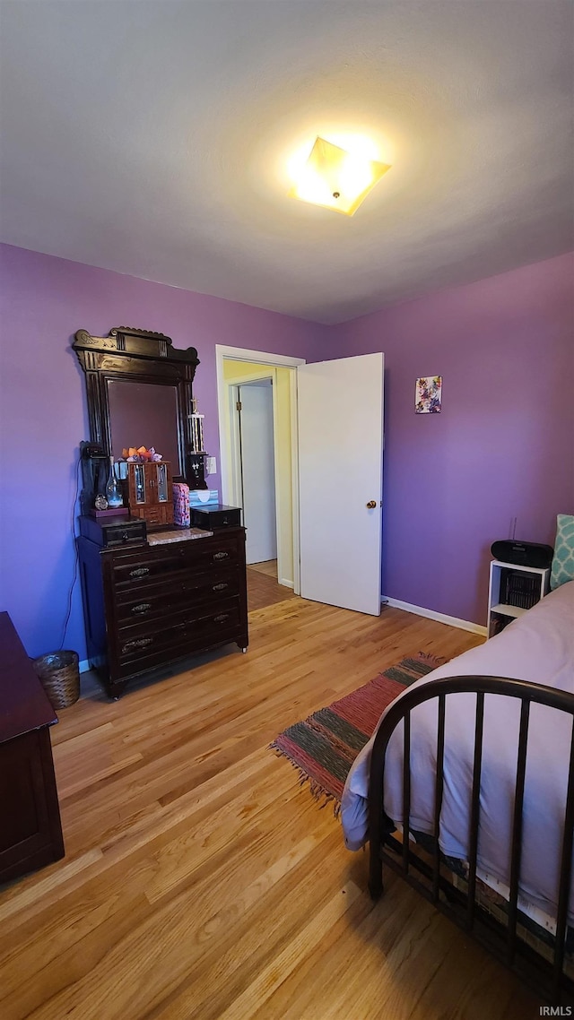6403 Old Trail Rd, Fort Wayne, IN 46809 - bedroom featuring light wood-style flooring and baseboards