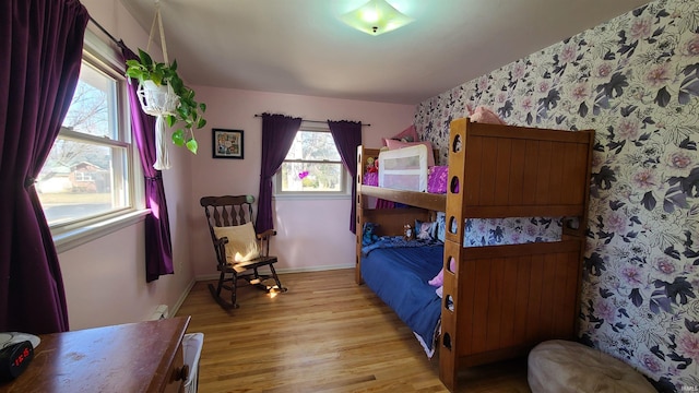 6403 Old Trail Rd, Fort Wayne, IN 46809 - bedroom featuring light wood-style flooring, baseboards, and wallpapered walls