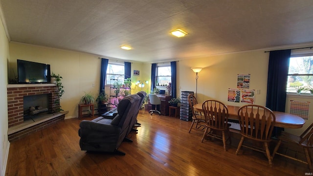 6403 Old Trail Rd, Fort Wayne, IN 46809 - living area featuring wood finished floors, plenty of natural light, a fireplace, and crown molding