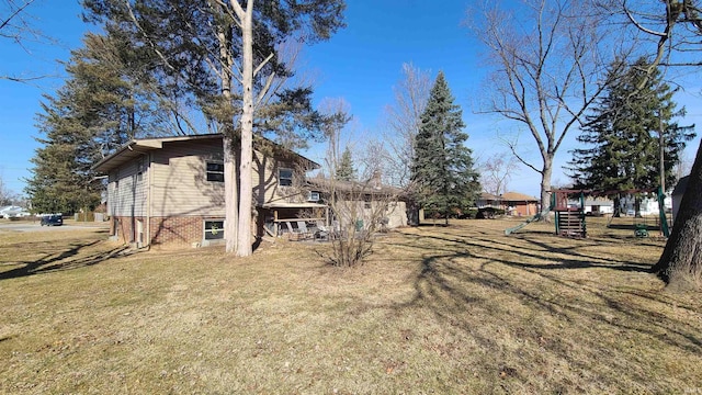6403 Old Trail Rd, Fort Wayne, IN 46809 - view of side of home featuring a playground and a yard