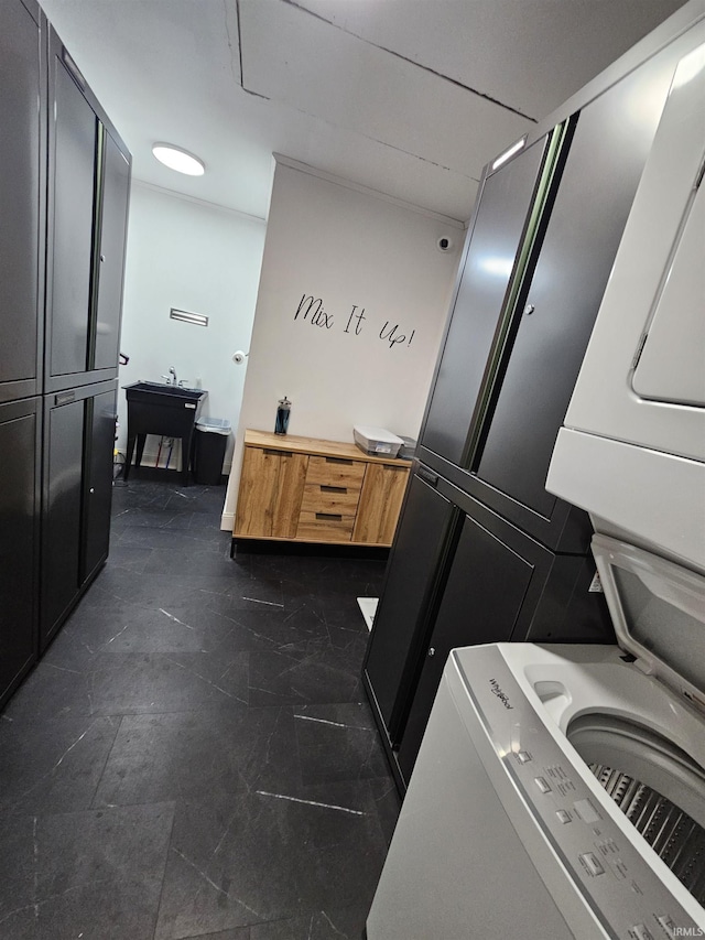 27 S Commerical St, Worthington, IN 47471 - laundry area featuring estacked washer and dryer and cabinet space