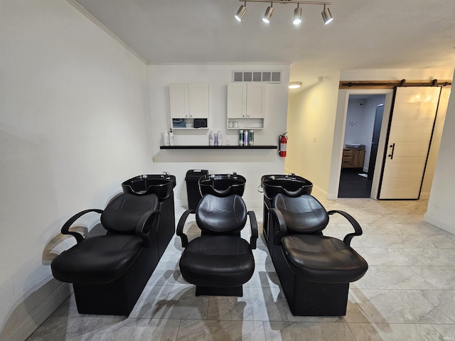 27 S Commerical St, Worthington, IN 47471 - cinema room featuring a barn door and baseboards