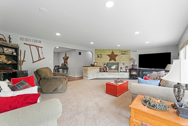 10317 Bass Rd, Fort Wayne, IN 46818 - living room with arched walkways, a fireplace, and recessed lighting