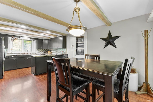10317 Bass Rd, Fort Wayne, IN 46818 - dining room featuring beam ceiling and wood finished floors