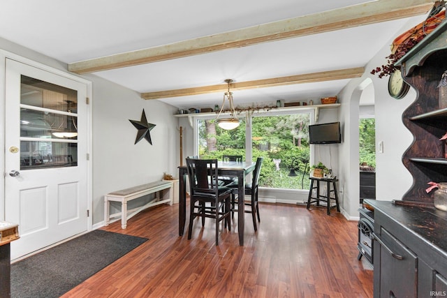 10317 Bass Rd, Fort Wayne, IN 46818 - dining area featuring healthy amount of natural light, arched walkways, dark wood finished floors, and beamed ceiling