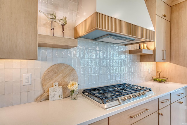 2909 Lake Dr, Newburgh, IN 47630 - kitchen featuring premium range hood, stainless steel gas cooktop, open shelves, light countertops, and backsplash