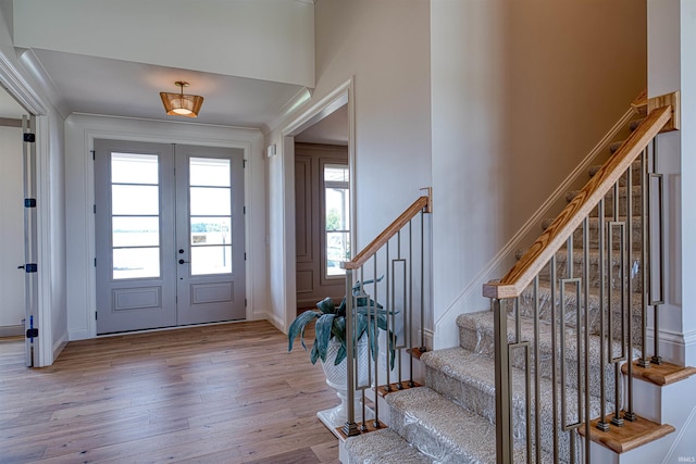 2909 Lake Dr, Newburgh, IN 47630 - entrance foyer with wood finished floors, french doors, stairway, and baseboards
