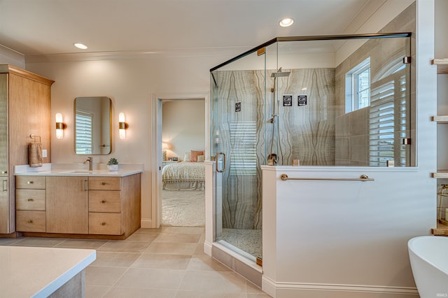 2909 Lake Dr, Newburgh, IN 47630 - bathroom featuring a shower stall, connected bathroom, vanity, tile patterned floors, and a freestanding tub