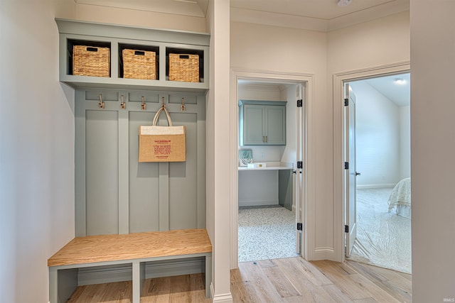 2909 Lake Dr, Newburgh, IN 47630 - mudroom with light wood finished floors, baseboards, and ornamental molding
