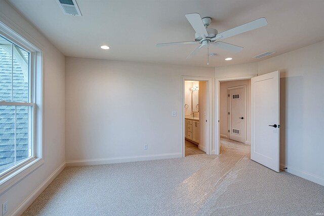 2909 Lake Dr, Newburgh, IN 47630 - unfurnished bedroom featuring light colored carpet, baseboards, recessed lighting, connected bathroom, and a ceiling fan