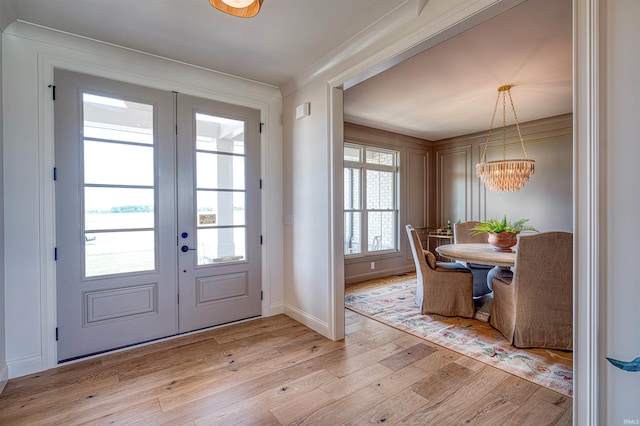 2909 Lake Dr, Newburgh, IN 47630 - entryway with french doors, light wood finished floors, a chandelier, and baseboards