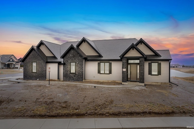 2088 Seward Lake Pass, Fort Wayne, IN 46814 - view of front of home with stone siding and roof with shingles