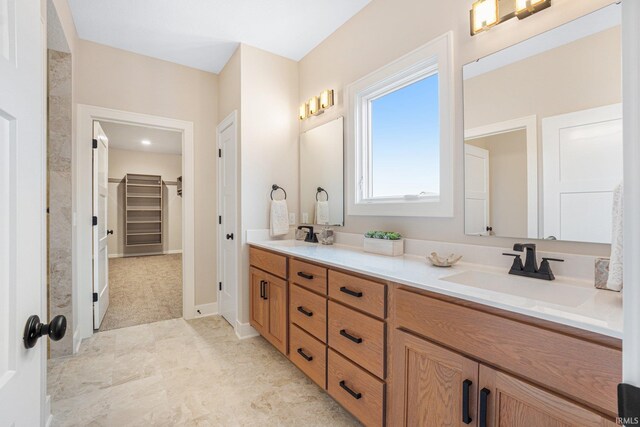2088 Seward Lake Pass, Fort Wayne, IN 46814 - bathroom featuring double vanity and a spacious closet