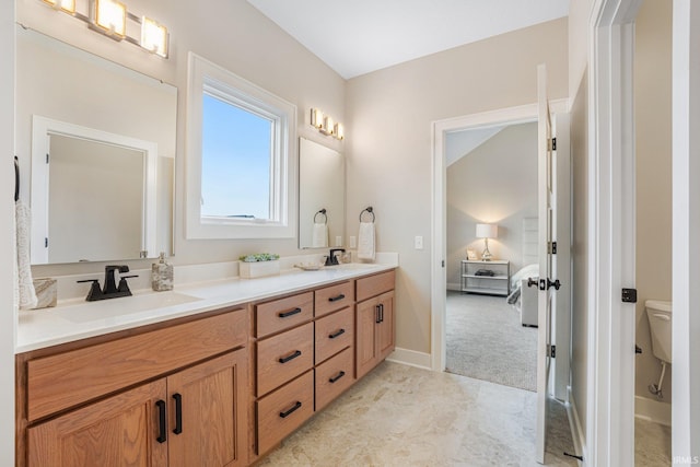 2088 Seward Lake Pass, Fort Wayne, IN 46814 - full bathroom featuring double vanity, connected bathroom, toilet, and baseboards