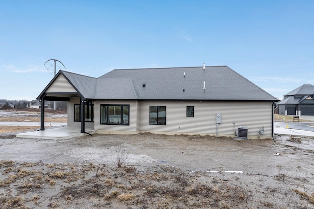 2088 Seward Lake Pass, Fort Wayne, IN 46814 - rear view of house with central air condition unit, a patio area, and a shingled roof