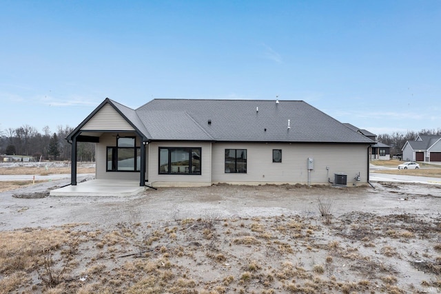 2088 Seward Lake Pass, Fort Wayne, IN 46814 - rear view of house featuring central air condition unit and roof with shingles
