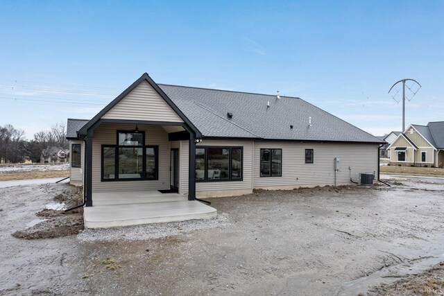 2088 Seward Lake Pass, Fort Wayne, IN 46814 - rear view of house featuring central AC, covered porch, and roof with shingles