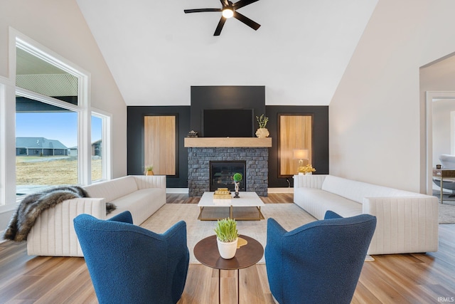 2088 Seward Lake Pass, Fort Wayne, IN 46814 - living area with ceiling fan, wood finished floors, high vaulted ceiling, and a glass covered fireplace