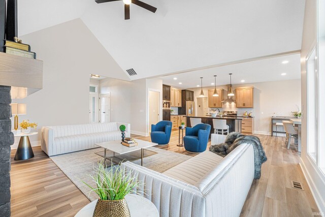 2088 Seward Lake Pass, Fort Wayne, IN 46814 - living area with high vaulted ceiling, light wood-style flooring, a ceiling fan, baseboards, and recessed lighting