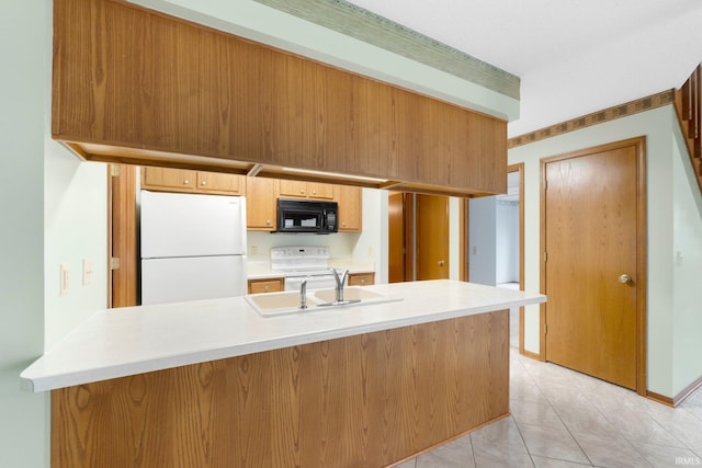 2223 Old Auburn Cv, Fort Wayne, IN 46845 - kitchen with white appliances, a sink, light countertops, a peninsula, and light tile patterned floors