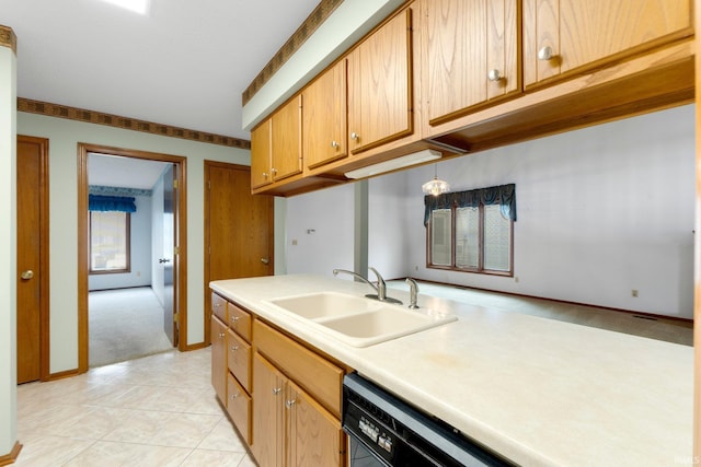 2223 Old Auburn Cv, Fort Wayne, IN 46845 - kitchen with a sink, light countertops, light carpet, baseboards, and brown cabinets