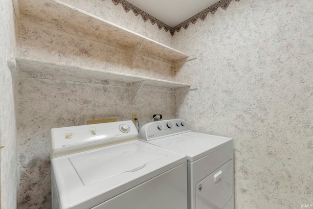 2223 Old Auburn Cv, Fort Wayne, IN 46845 - laundry room featuring washing machine and clothes dryer and wallpapered walls