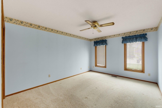 2223 Old Auburn Cv, Fort Wayne, IN 46845 - empty room featuring carpet, baseboards, and ceiling fan