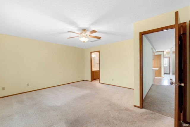 2223 Old Auburn Cv, Fort Wayne, IN 46845 - empty room with light carpet, ceiling fan, and baseboards