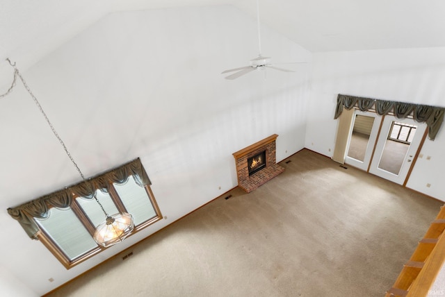 2223 Old Auburn Cv, Fort Wayne, IN 46845 - unfurnished living room with lofted ceiling, ceiling fan, carpet flooring, and a fireplace