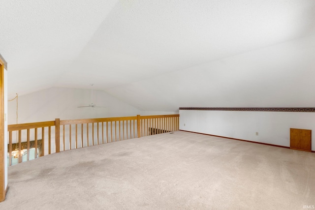 2223 Old Auburn Cv, Fort Wayne, IN 46845 - additional living space featuring carpet floors, vaulted ceiling, ceiling fan, and baseboards