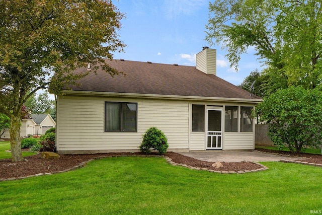 2223 Old Auburn Cv, Fort Wayne, IN 46845 - rear view of property featuring a patio, a chimney, a sunroom, and a lawn