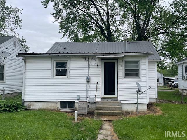 3007 S Hackley St, Muncie, IN 47302 - rear view of property with metal roof, entry steps, and cooling unit