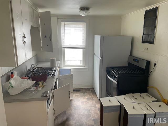 3007 S Hackley St, Muncie, IN 47302 - kitchen featuring stainless steel gas stove and a sink