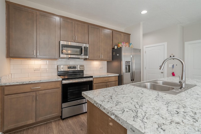 4755 Eastwick Dr, Newburgh, IN 47630 - kitchen with appliances with stainless steel finishes, a sink, dark wood finished floors, light countertops, and recessed lighting